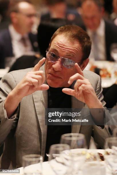 Jean-Claude Van Damme talks to Minister for Foreign Affairs Julie Bishop before Prime Minister Malcolm Turnbull addresses guests at the NSW Federal...