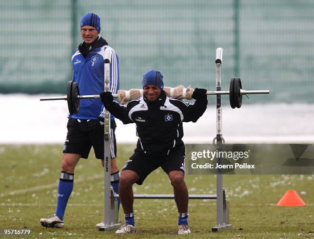 Dennis Aogo of Hamburg lifts a barbell during the Hamburger SV training session at the HSH Nordbank Arena on January 12, 2010 in Hamburg, Germany.