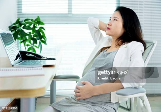 pregnant woman having neck pain - working mom exhausted stock pictures, royalty-free photos & images