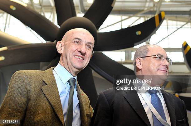 Chief executive officer Louis Gallois poses with the head of Airbus Military Domingo Urena-Raso in front of the Airbus A400M at the military...