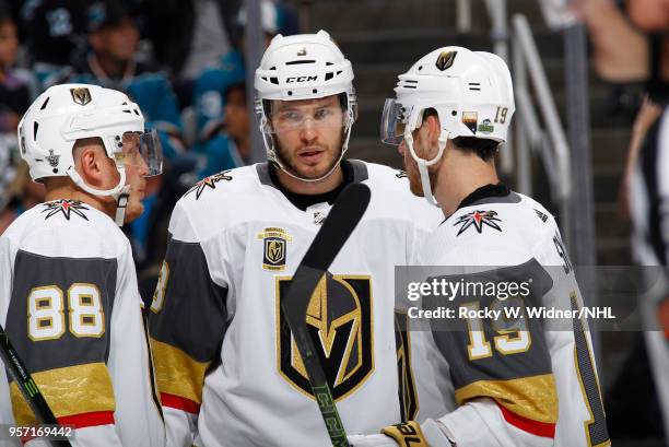 Nate Schmidt, Brayden McNabb and Reilly Smith of the Vegas Golden Knights talk during the game against the San Jose Sharks in Game Six of the Western...