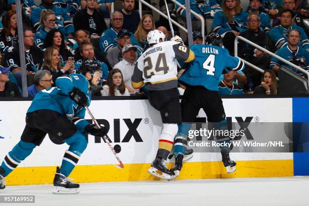 Oscar Lindberg of the Vegas Golden Knights and Brenden Dillon of the San Jose Sharks collide in Game Six of the Western Conference Second Round...