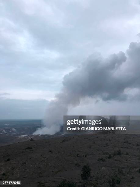 Smoke from the Kilauea volcano rises from the Halemaumau crater on the Big Island in Hawaii, May 9, 2018. - Kilauea, one of the most active volcanos...