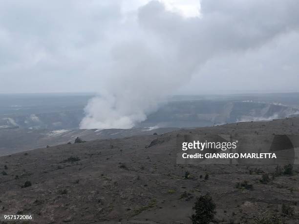 Smoke from the Kilauea volcano rises from the Halemaumau crater on the Big Island in Hawaii, May 9, 2018. - Kilauea, one of the most active volcanos...