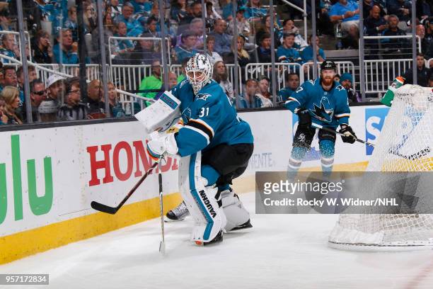 Martin Jones of the San Jose Sharks clears the puck against the Vegas Golden Knights in Game Six of the Western Conference Second Round during the...