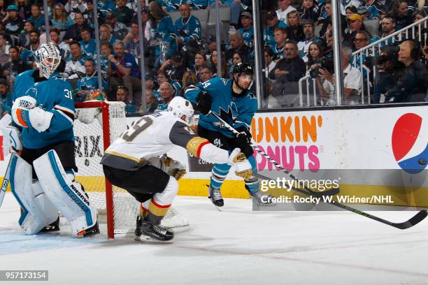 Marc-Edouard Vlasic of the San Jose Sharks clears the puck against Reilly Smith of the Vegas Golden Knights in Game Six of the Western Conference...