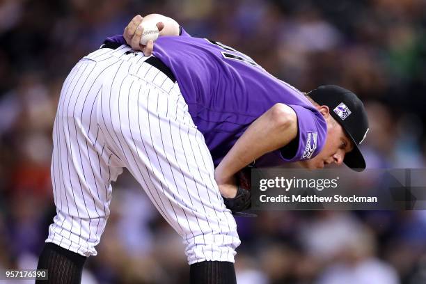 Pitcher Jake McGee of the Colorado Rockies throws in the ninth inning against the Milwaukee Brewers at Coors Field on May 10, 2018 in Denver,...