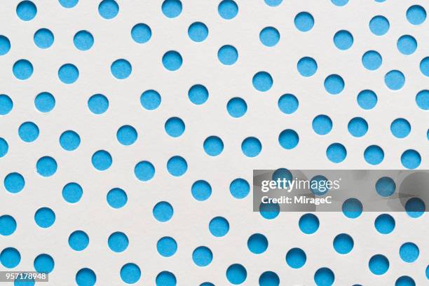 spotted pattern paper art - perforated paper stock pictures, royalty-free photos & images