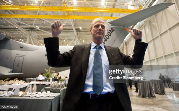 Tom Enders, chief executive officer of Airbus SAS, reacts in front of an Airbus A400M prior to a press conference at the Airbus facility in Seville,...