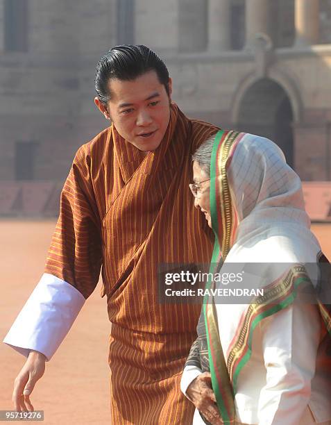 King of Bhutan, Jigme Khesar Namgyel Wangchuck chats with Indian President Pratibha Patil during a welcome ceremony at the Presidential Palace in New...