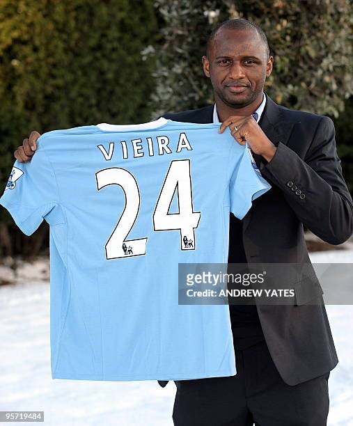 New Manchester City signing Patrick Vieira poses for photographers at the Club's Carrington training complex in Manchester, north-west England, on...