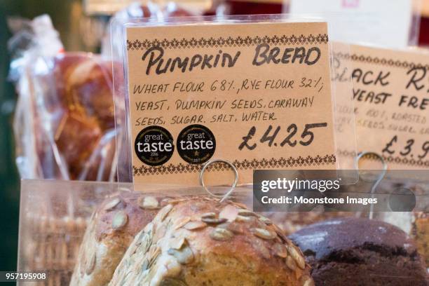 pumpkin bread in borough market, london - pumpkin bread stock pictures, royalty-free photos & images