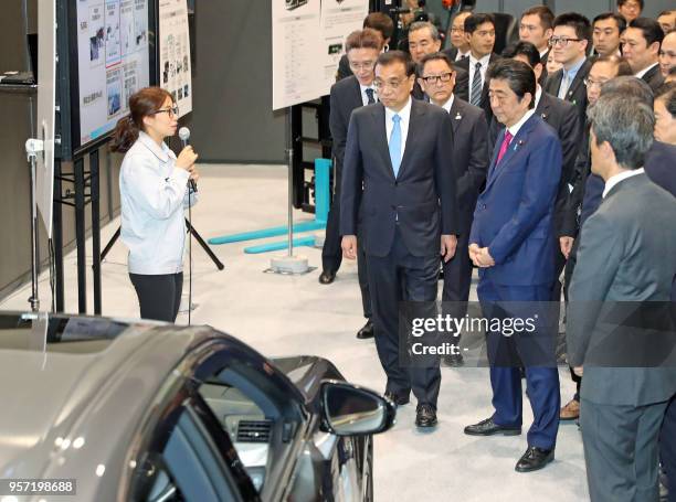 Chinese Premier Li Keqiang and Japanese Prime Minister Shinzo Abe visit the Toyota Motor Hokkaido in Tomakomai, Hokkaido prefecture on May 11, 2018....