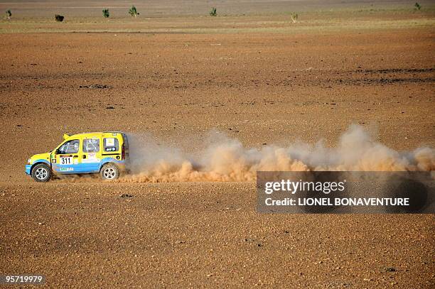 Algerian Mohamed Asloun drives his Renault Kangoo during the 9th stage Tabenkrout - Tenadi, Mauritania, of the second edition of the Africa Eco Race,...