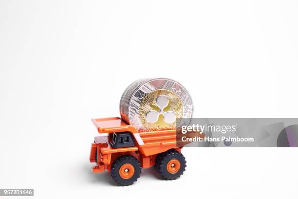 mining truck full of ripple xrp coins - palmboom stock pictures, royalty-free photos & images