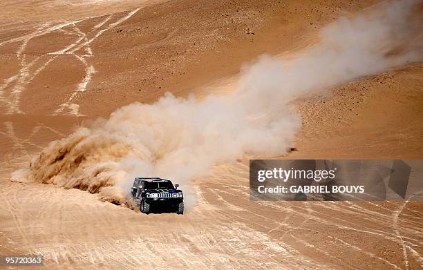 Robby Gordon steers his hummer during the 7th stage of the Dakar 2010, between Iquique and Antofagasta, Chile, on January 8, 2010. Qatar's Nasser...