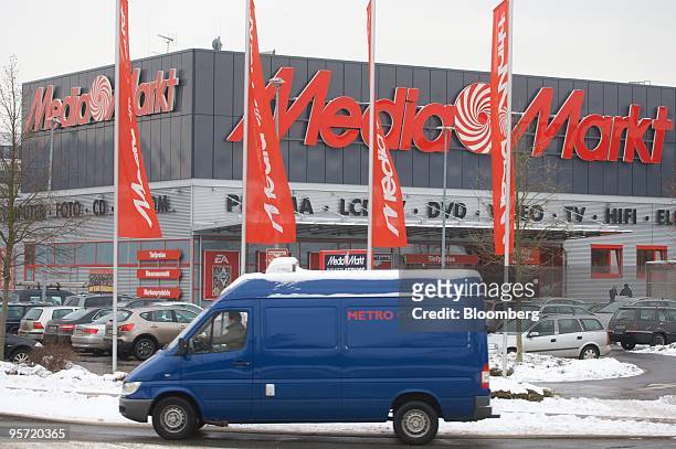 Metro AG van passes one of the group's MediaMarkt stores in Duesseldorf, Germany, on Tuesday, Jan. 12, 2010. Metro AG, Germany's largest retailer,...