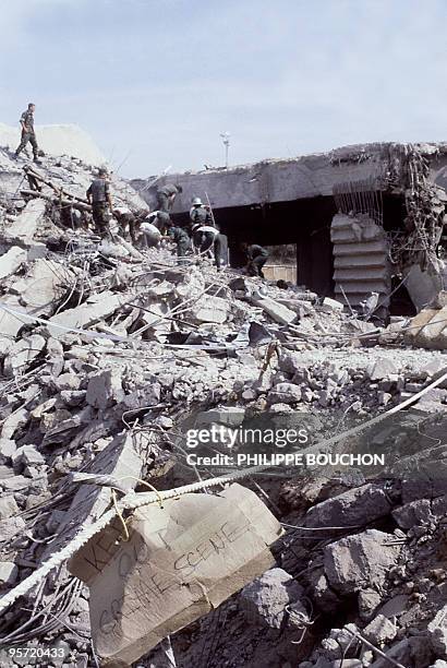 Rescuers continue 31 October 1983 to search for corpses and identify the victims of the attack on the 23rd October of the headquarters of the U.S....