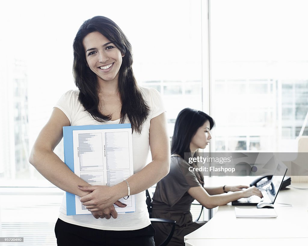 Portrait of woman smiling at work