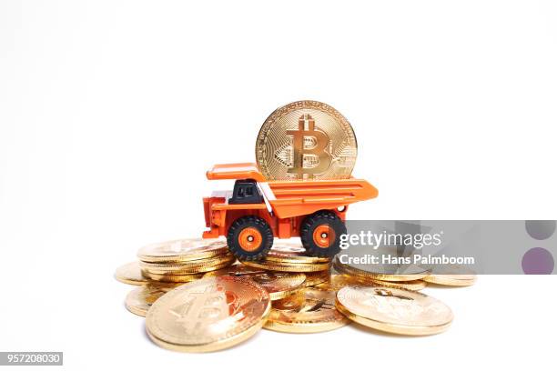 mining truck full of bitcoins coins - mining truck stock-fotos und bilder