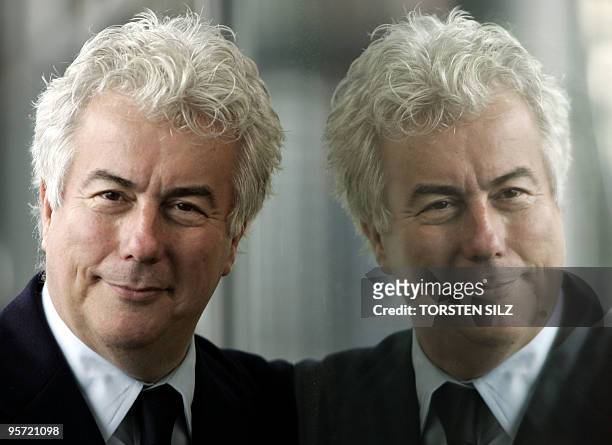 Best selling Welsh author Ken Follett is reflected as he poses for photographers prior to a discussion at the Frankfurt Book Fair 19 October 2005....