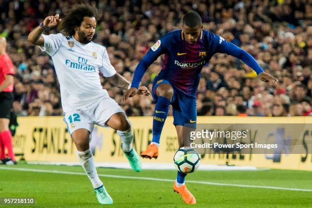 Nelson Cabral Semedo of FC Barcelona battles for the ball with Marcelo Vieira Da Silva of Real Madrid during the La Liga match between Barcelona and...