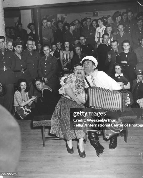 While most of the guests, armed forces personnel, watched the entertainment, a romance blossomed between a French sailor and Canteen Hostess Barbara...