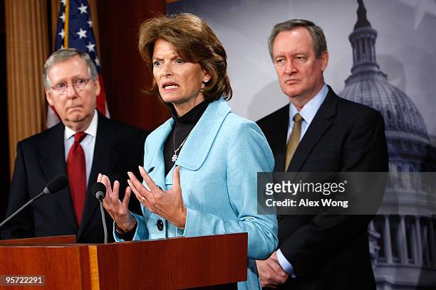 Sen. Lisa Murkowski speaks as Senate Minority Leader Sen. Mitch McConnell and Sen. Mike Crapo listen during a news conference on Capitol Hill January...