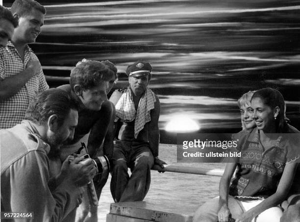 Cuban president taking photos with an East German Praktisix camera near Playa Giron - 1962
