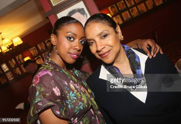 Condola Rashad and her mother Phylicia Rashad pose as Condola Rashad recieves her caricature for her role in the MTC play "St. Joan" at Sardis on May...
