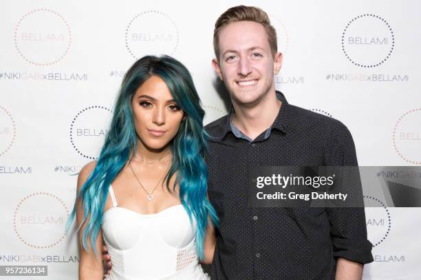 Niki DeMartino and Mike Leddy attends the Niki & Gabi DeMartino X Bellami Collection Launch Party at Avenue on May 10, 2018 in Los Angeles,...