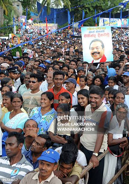 Supporters of Sri Lanka's President Mahinda Rajapakse attend an election rally in the southern coastal town of Ambalangoda on January 12, 2010....