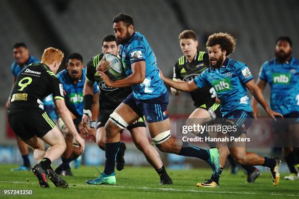 Patrick Tuipulotu of the Blues makes a break during the round 12 Super Rugby match between the Blues and the Hurricanes at Eden Park on May 11, 2018...