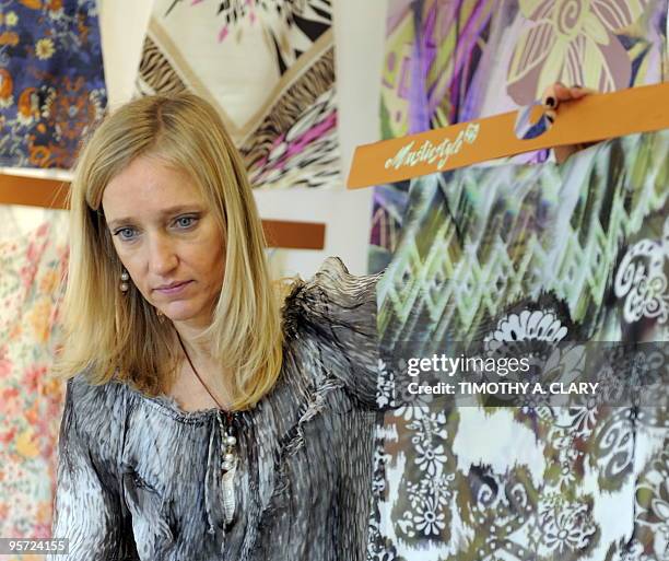 Member of the trade goes through fabric by Paradox Designs during the Direction by Indigo International Exhibition of Creative Textile Design on...
