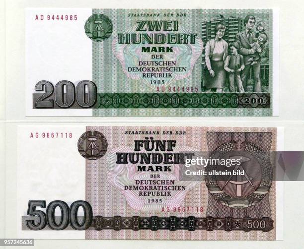 Zwei Banknoten der Staatsbank der DDR, die zu den weniger im Umlauf befindlichen Geldscheinen gehörten: ein 200,- und edin 500,- Mark- Schein der...