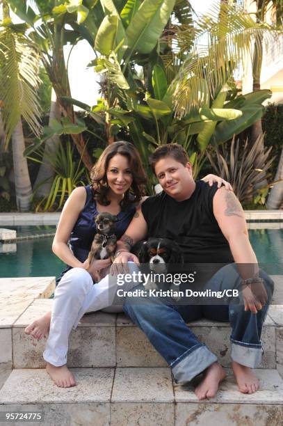 Jennifer Elia and Chaz Bono pose with dogs Rocco and Lola during a photo shoot on October 22, 2009 in Los Angeles, Calofornia.