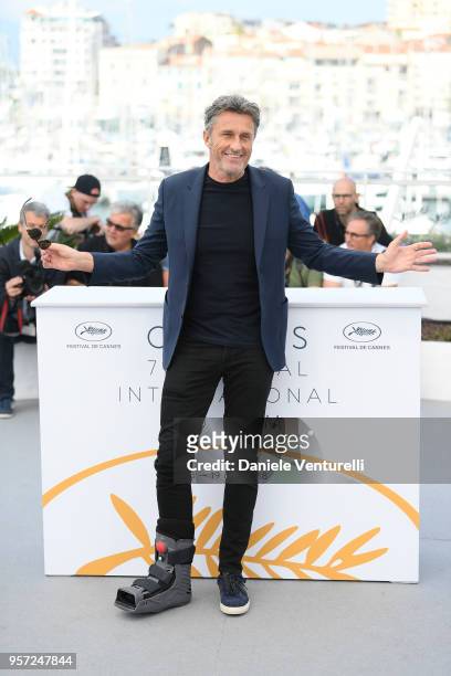 Director Pawel Pawlikowski wears a foot brace as he attends the photocall for "Cold War " during the 71st annual Cannes Film Festival at Palais des...