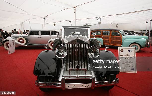 Visitors have a look at a 1934 Rolls Royce displayed at the ongoing Auto Expo 2010 at Pragati Maidan in New Delhi on Sunday, January 10, 2010.