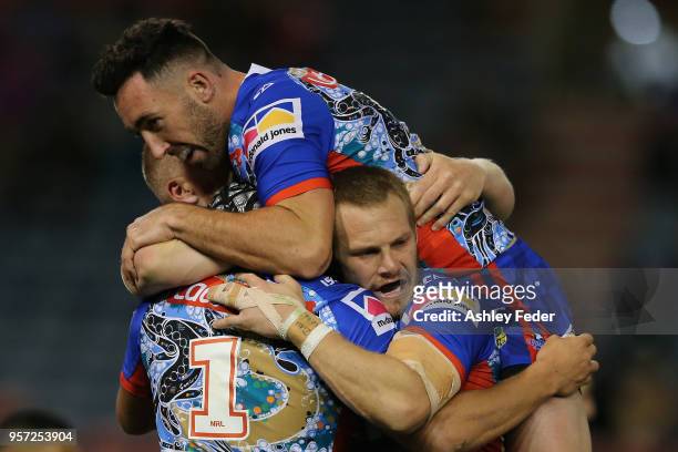 Knights players celebrate a try from Kaylin Ponga during the round 10 NRL match between the Newcastle Knights and the Penrith Panthers at McDonald...