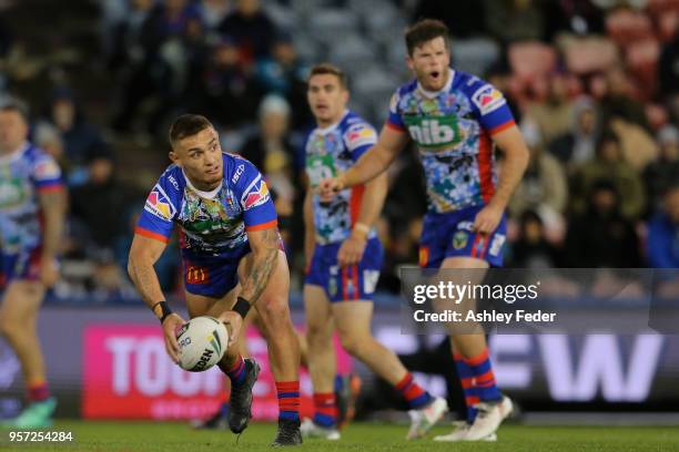 Daniel Levi of the Knights passes the ball during the round 10 NRL match between the Newcastle Knights and the Penrith Panthers at McDonald Jones...