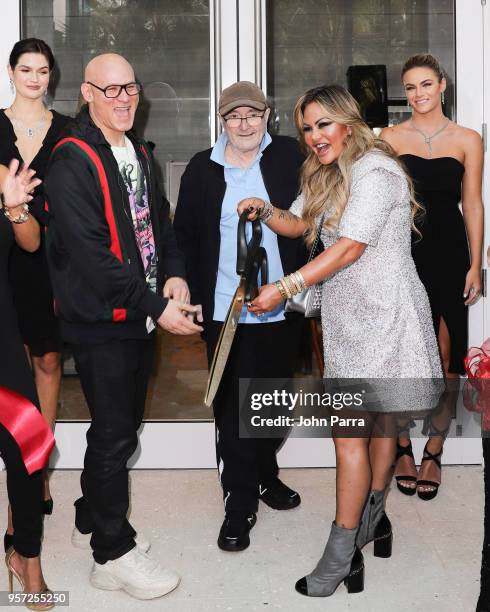 Craig Robins, Phil Collins, Orianne Collins and Renata Munoz cut the red ribbon at Orianne Collins Jewellery Grand Opening on May 10, 2018 in Miami,...