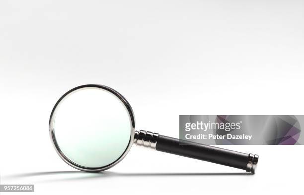 magnifying glass on white - magnifying glass stock pictures, royalty-free photos & images