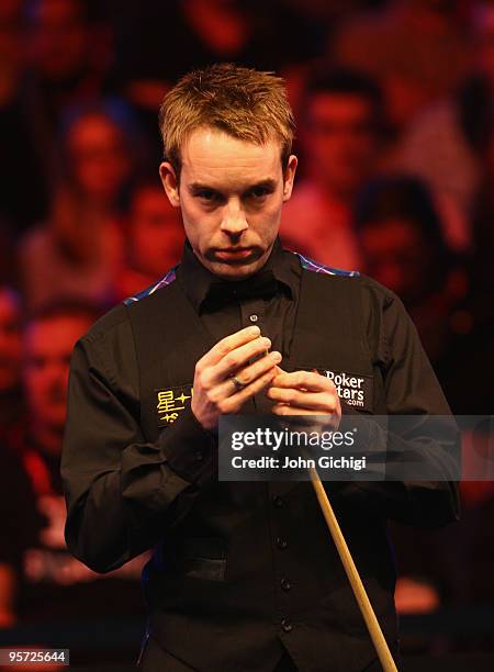 Ali Carter of England prepares to take a shot in his second round match against Mark Williams of Wales during the PokerStars.com Masters at Wembley...