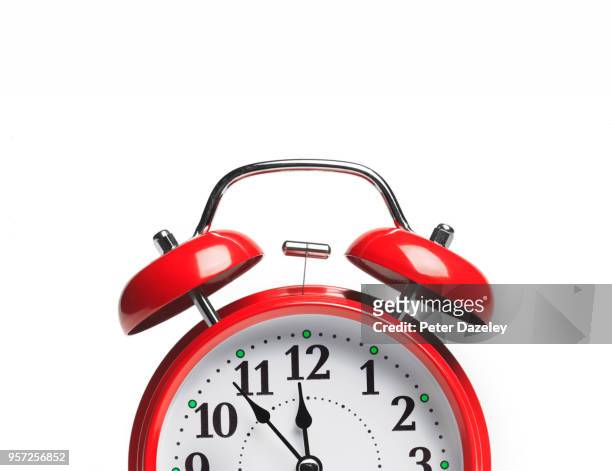 red alarm clock with copy space - clock stock-fotos und bilder