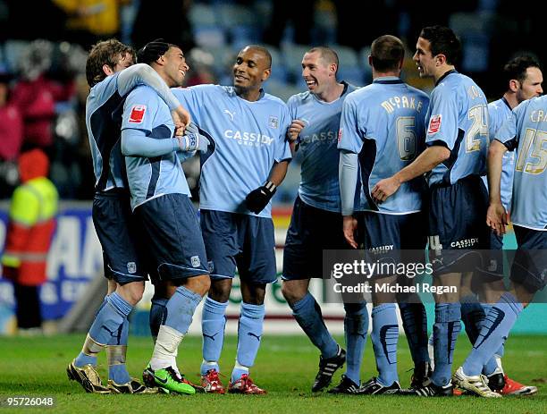 Leon Best of Coventry is congratulated by teammates after scoring the opening goal during the FA Cup sponsored by E.ON 3rd round replay match between...