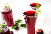 Kokum Sharbat, Juice or Sherbet OR summer coolant drink made up of Garcinia indica with raw fruit, served in a glass with mint leaf. selective focus