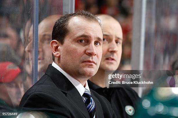 Head Coach Todd Richards of the Minnesota Wild stands behind the bench against the New Jersey Devils during the game at the Xcel Energy Center on...