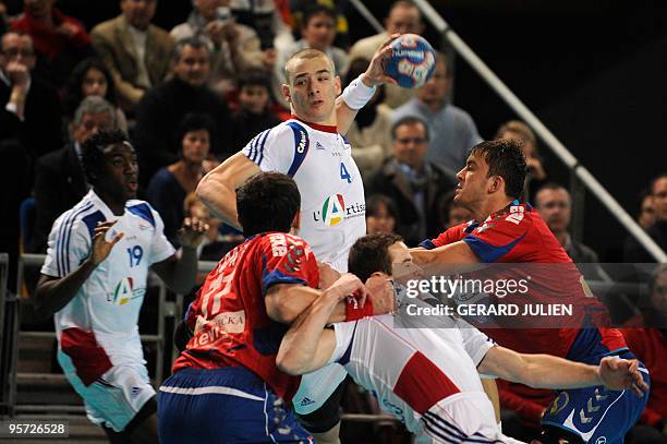 French Xavier Barachet tries to score despite Serbian Alem Toskic and Momit Ilic during the handball friendly match France vs. Serbia, on January 12,...