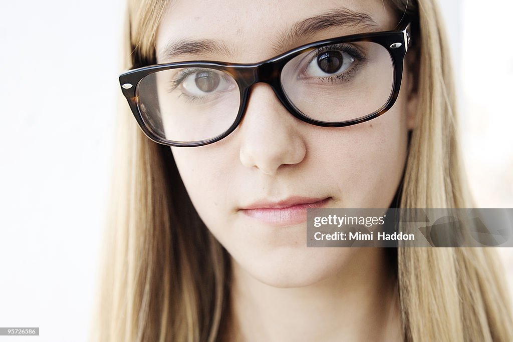 Portrait of Blonde Teenage Girl with Glasses