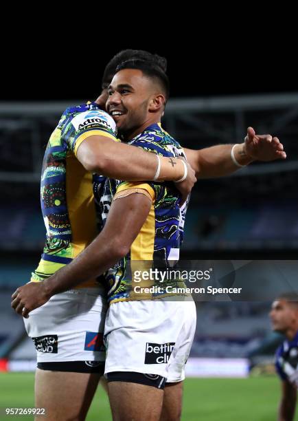 Bevan French of the Eels is embraced by team mate Brad Takairangi after scoring a try during the round 10 NRL match between the Canterbury Bulldogs...